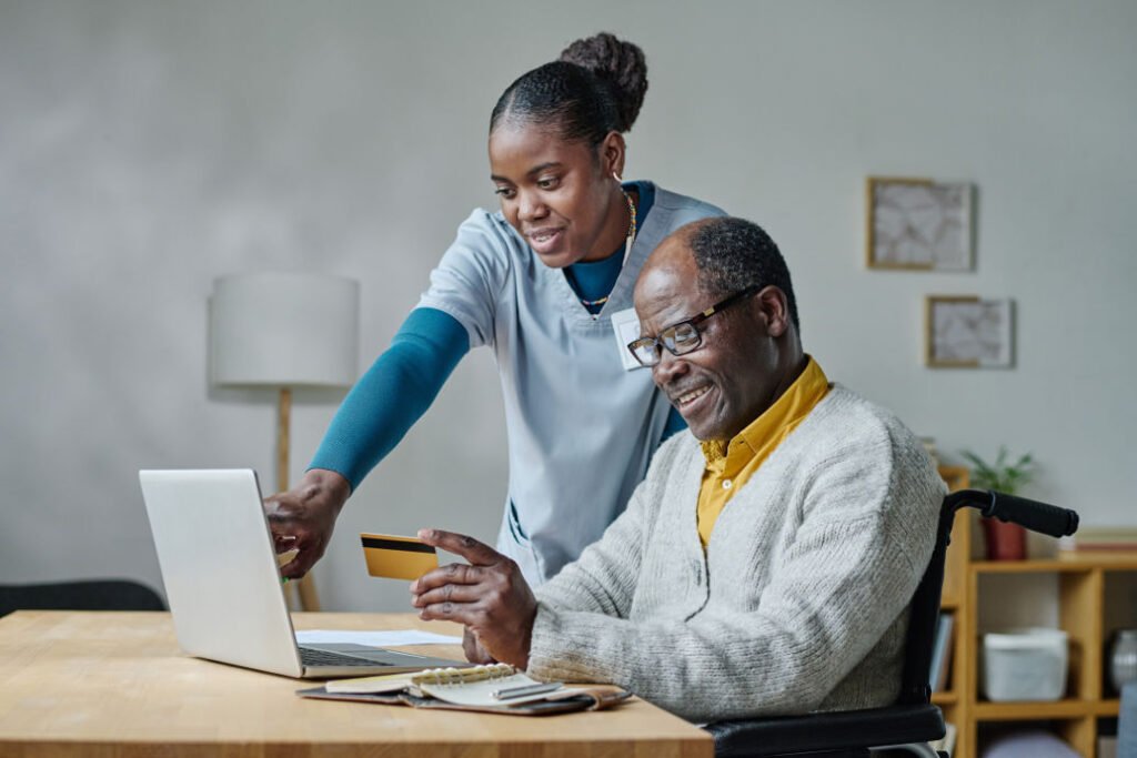 Northern Disability Services Change Lives - Caregiver explaining man to pay online PO Box 3028 Salisbury East Northbri Av 5109 0424-010-930 https://ndssa.com.au/
